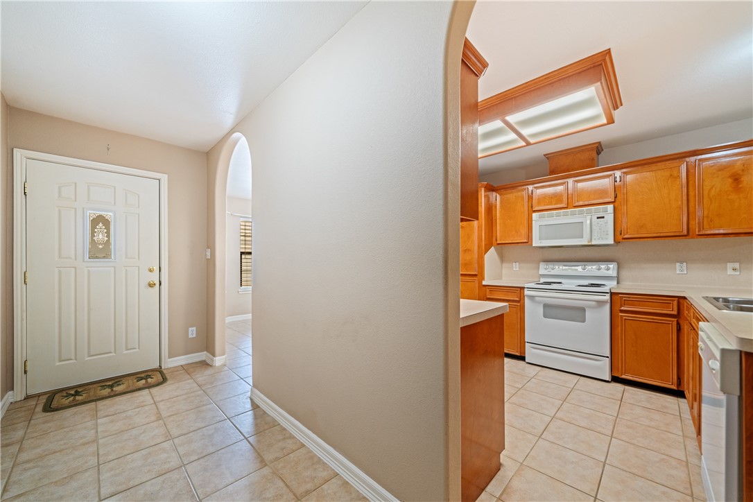 2839 McKinzie Road, Unit 10 Corpus Christi, TX 78410 - Photo 3 of 22 a kitchen with stainless steel appliances granite countertop a refrigerator and a stove top oven