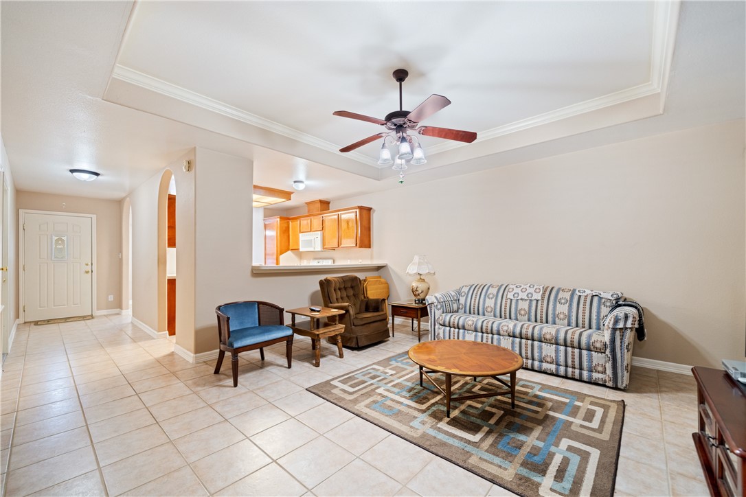 2839 McKinzie Road, Unit 10 Corpus Christi, TX 78410 - Photo 4 of 22 a living room with furniture and a chandelier