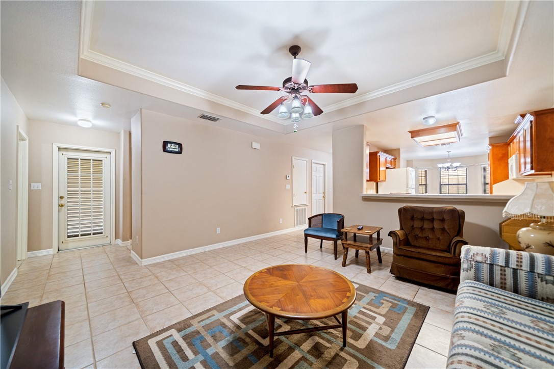2839 McKinzie Road, Unit 10 Corpus Christi, TX 78410 - Photo 5 of 22 a living room with furniture a dining table and chairs with wooden floor