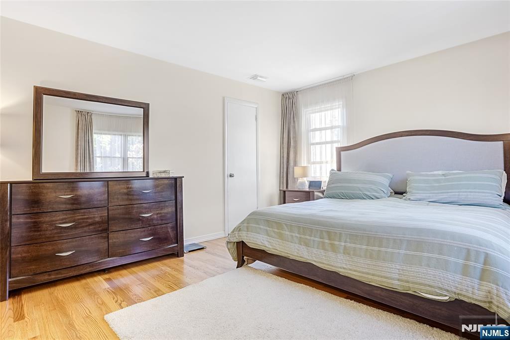 193 Prospect Place Rutherford, NJ 07070 - Photo 17 of 37 a bedroom with a bed and a dresser