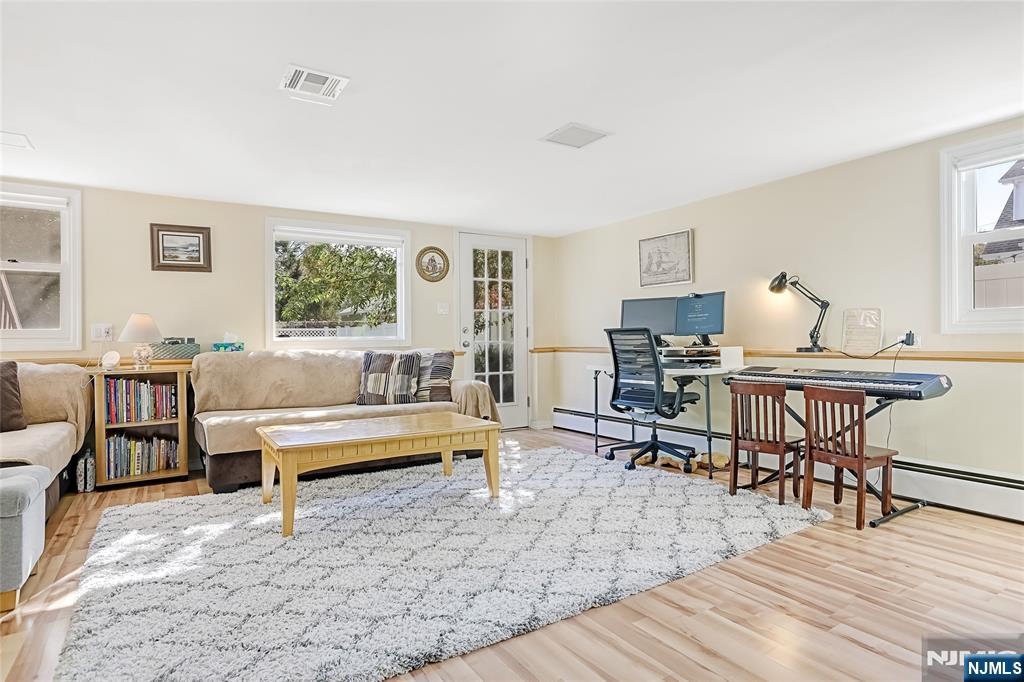 193 Prospect Place Rutherford, NJ 07070 - Photo 21 of 37 a living room with furniture a wooden floor and a window