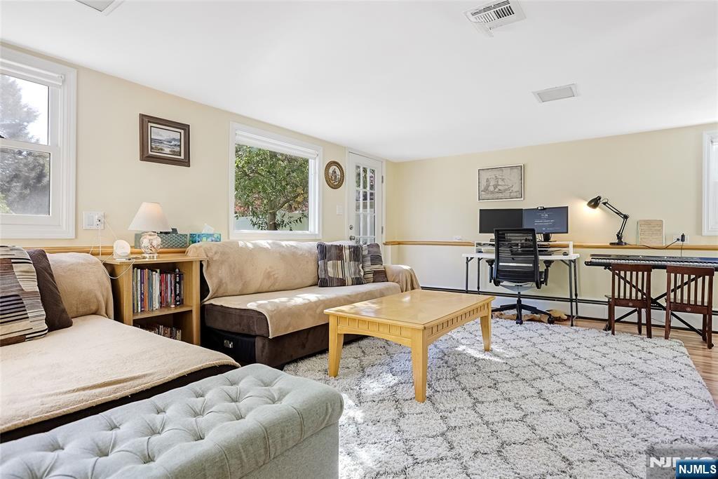 193 Prospect Place Rutherford, NJ 07070 - Photo 25 of 37 a living room with furniture and a window