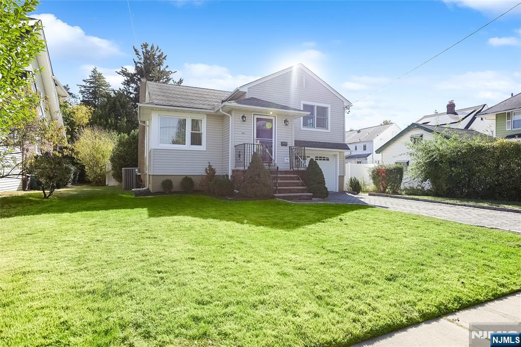 193 Prospect Place Rutherford, NJ 07070 - Photo 28 of 37 a front view of house with yard and swimming pool
