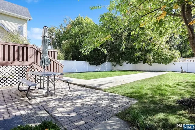 a view of a swimming pool with a yard