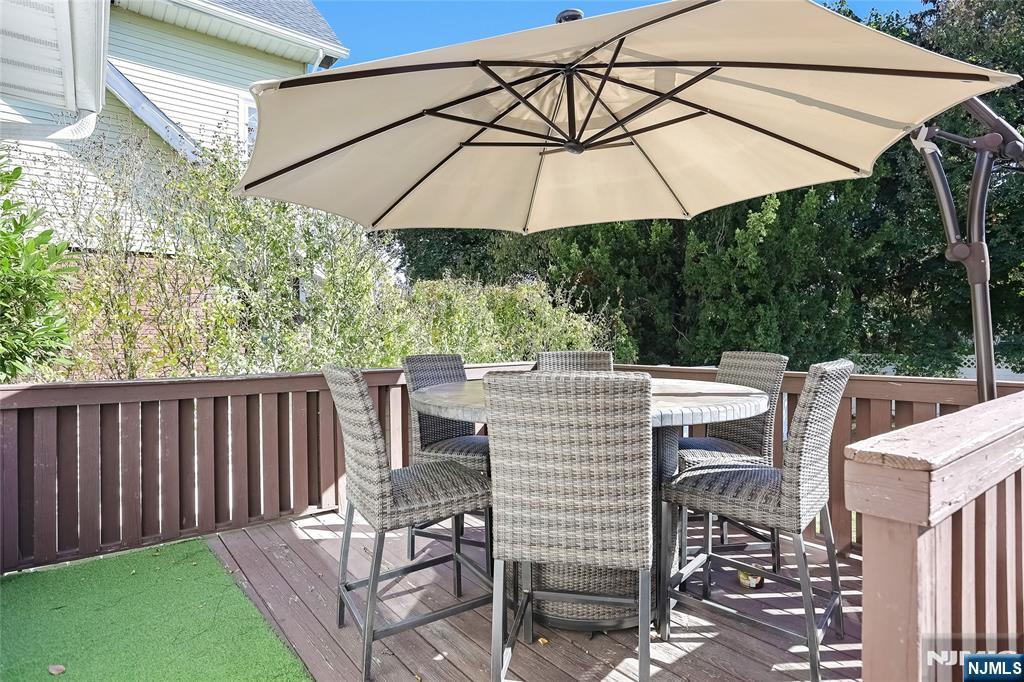 193 Prospect Place Rutherford, NJ 07070 - Photo 34 of 37 a patio with a patio table and chairs