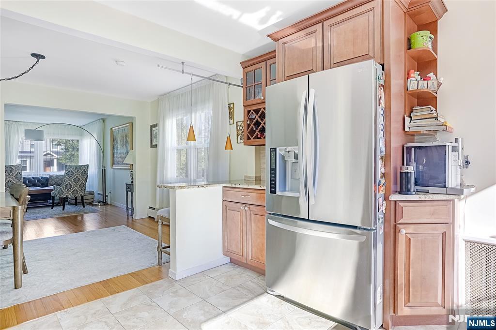 193 Prospect Place Rutherford, NJ 07070 - Photo 9 of 37 a kitchen with stainless steel appliances a refrigerator and a stove