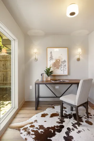 a balcony with table and chairs