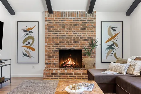 a kitchen with kitchen island a sink stove and refrigerator