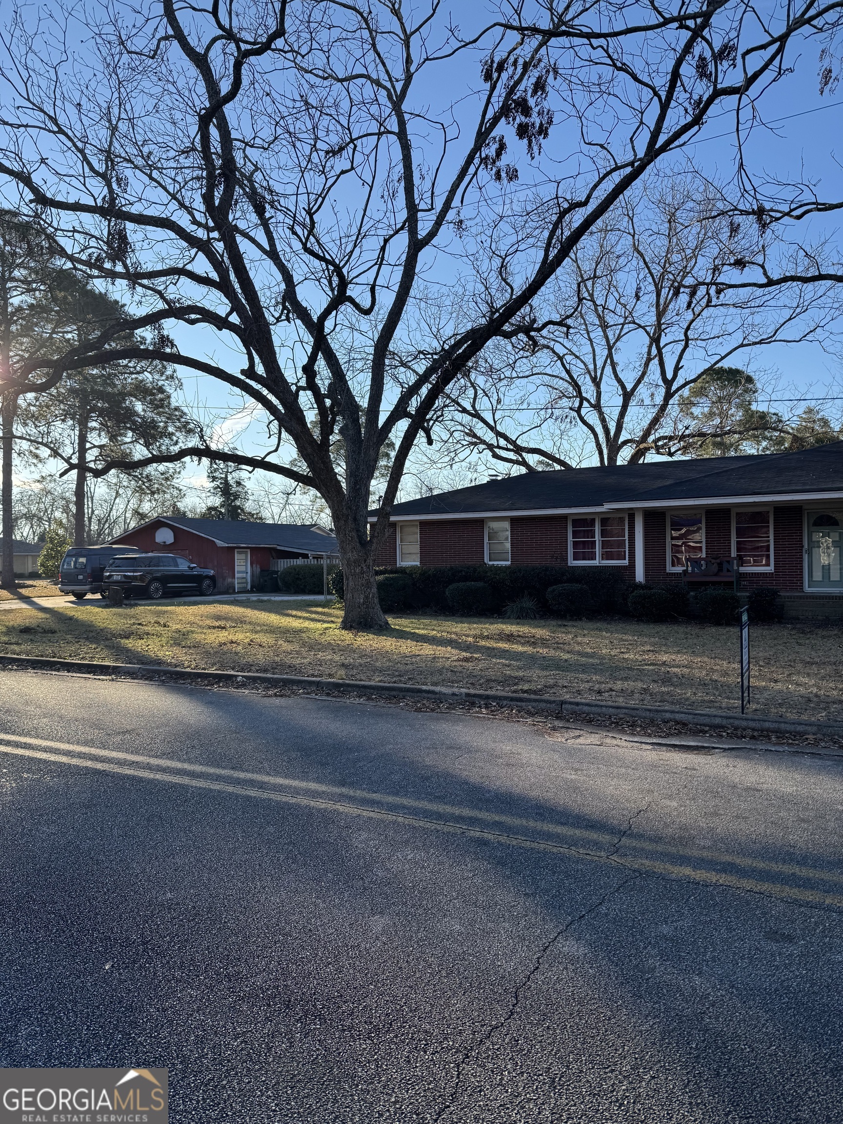 606 Park Avenue Claxton, GA 30417 - Photo 2 of 38 a house that has a tree in front of it