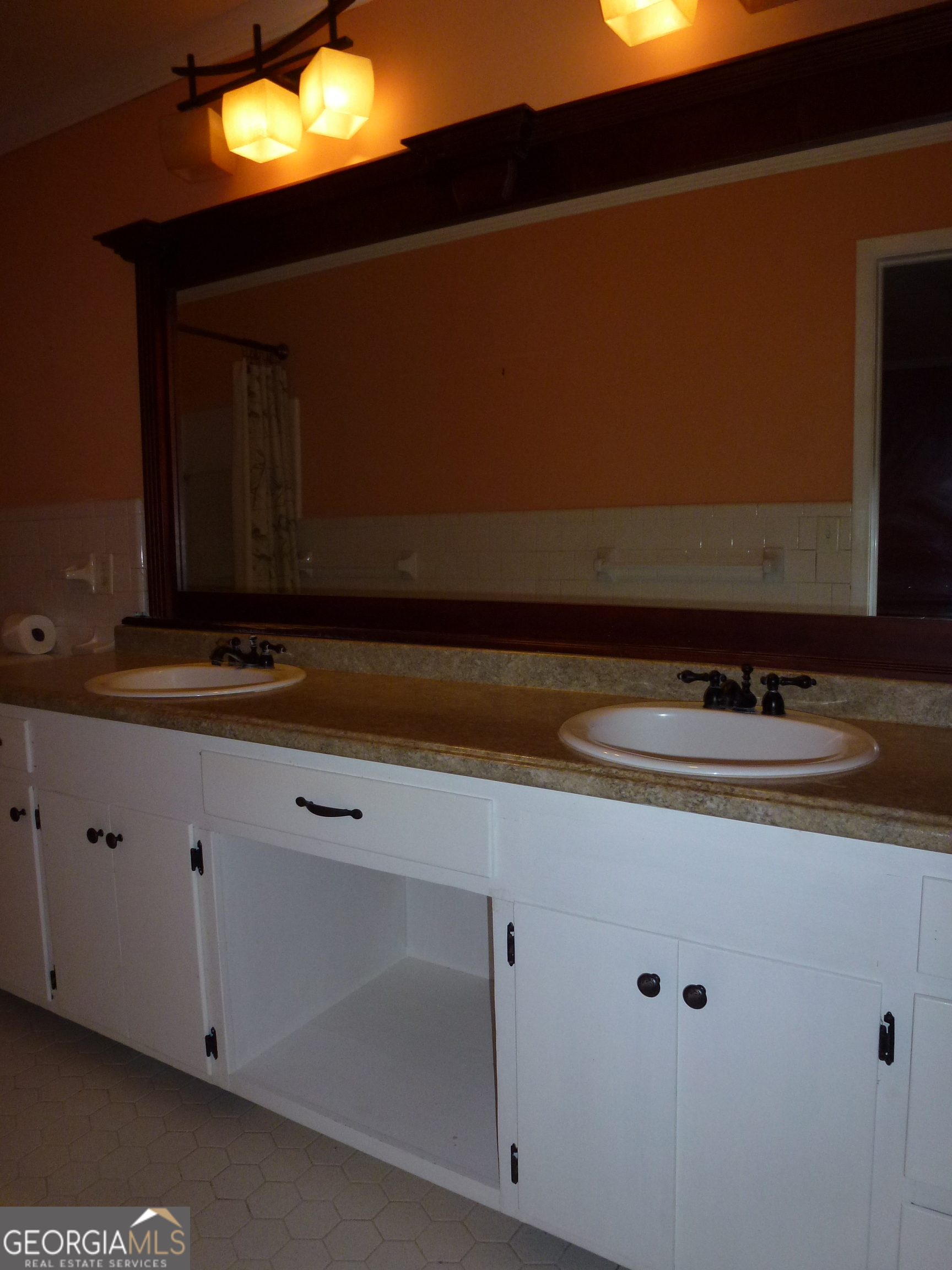 606 Park Avenue Claxton, GA 30417 - Photo 30 of 38 a bathroom with a sink and a mirror