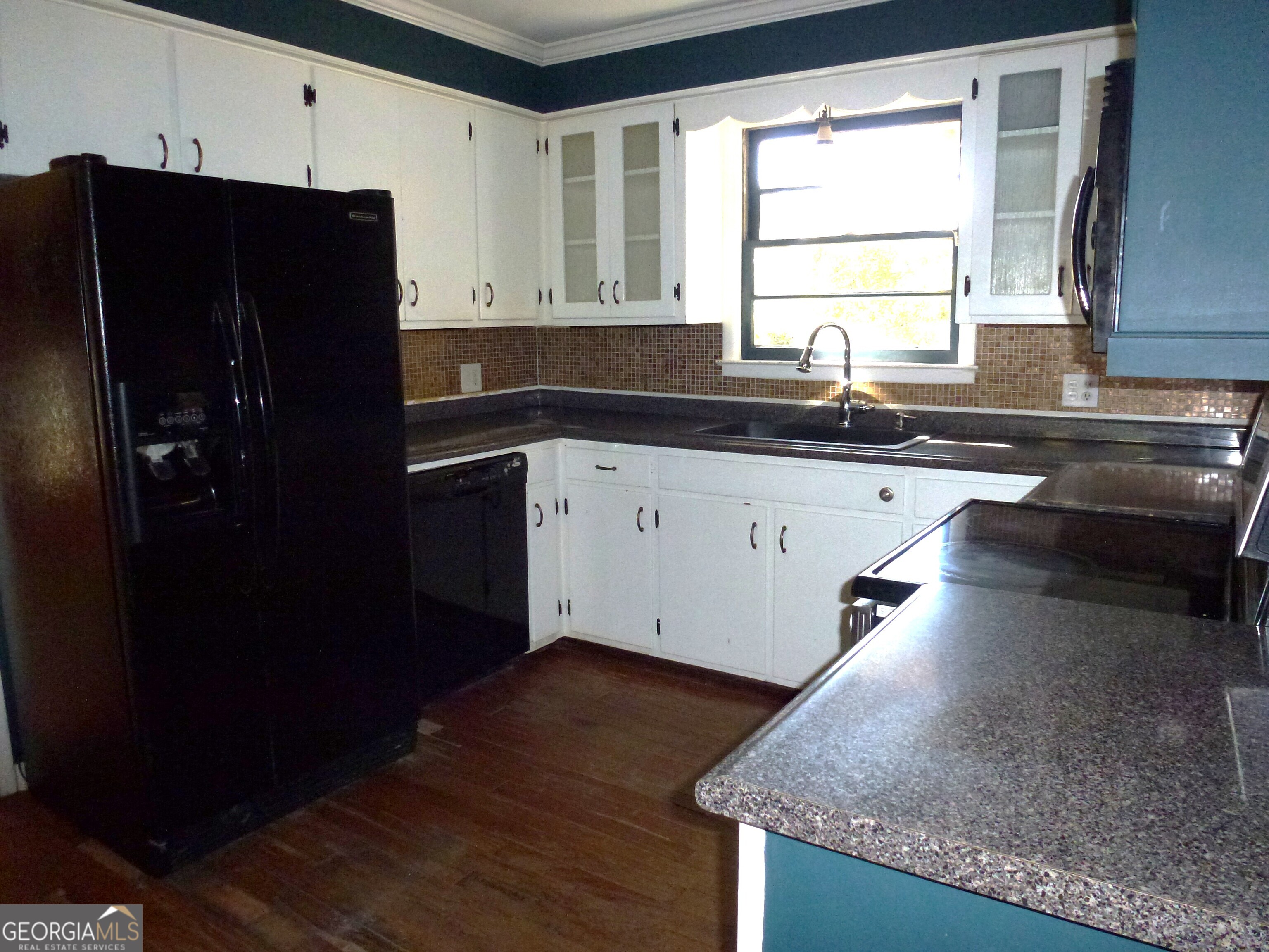 606 Park Avenue Claxton, GA 30417 - Photo 10 of 38 a kitchen with granite countertop stainless steel appliances a refrigerator a sink and a stove