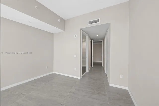 a view of a room with gym equipment and building