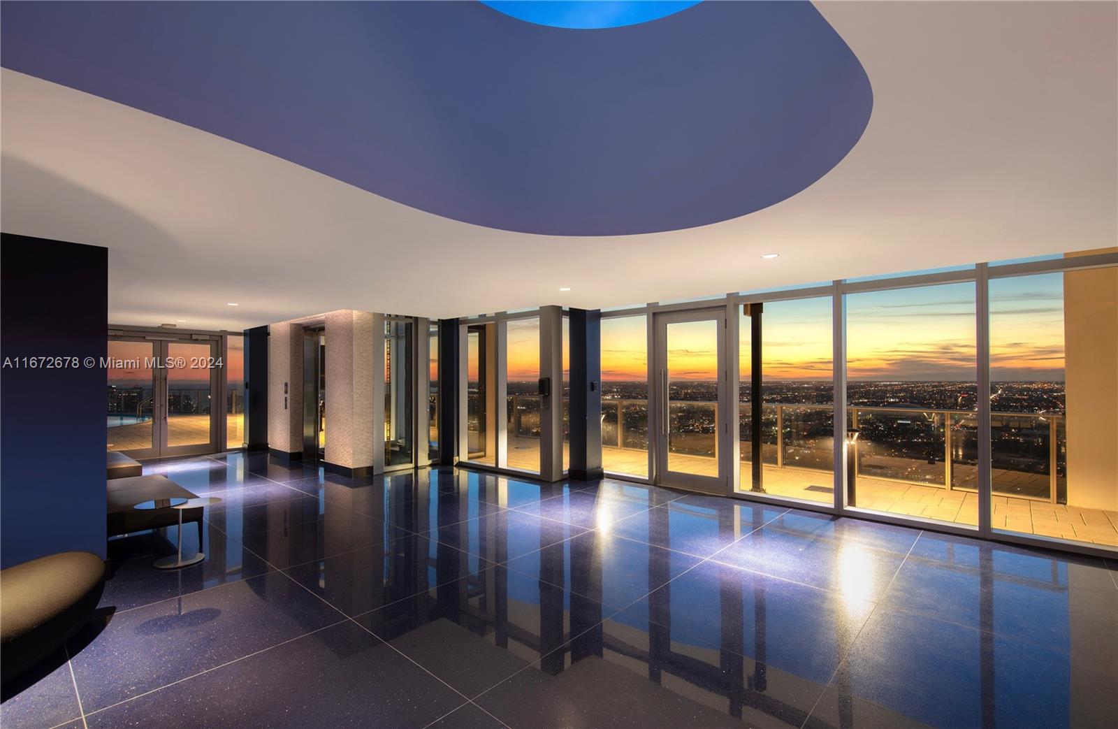 851 Northeast 1st Avenue, Unit PH5402 Miami, FL 33132 - Photo 61 of 61 a lobby with furniture and floor to ceiling window