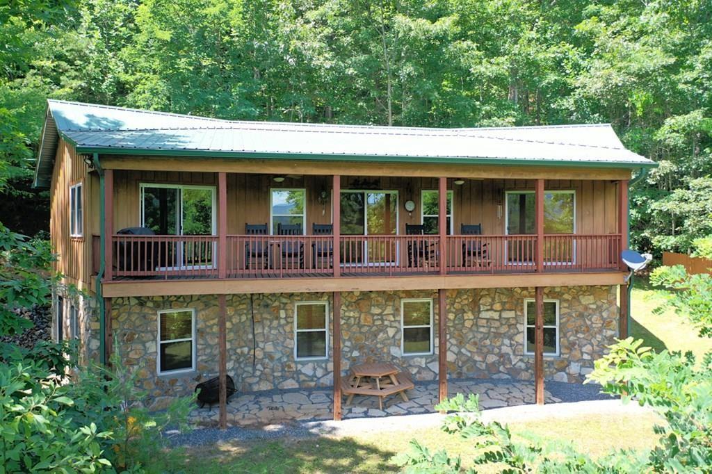470 Bear Ridge Road Tuckasegee, NC 28783 - Photo 1 of 28 front view of a brick house with a large window