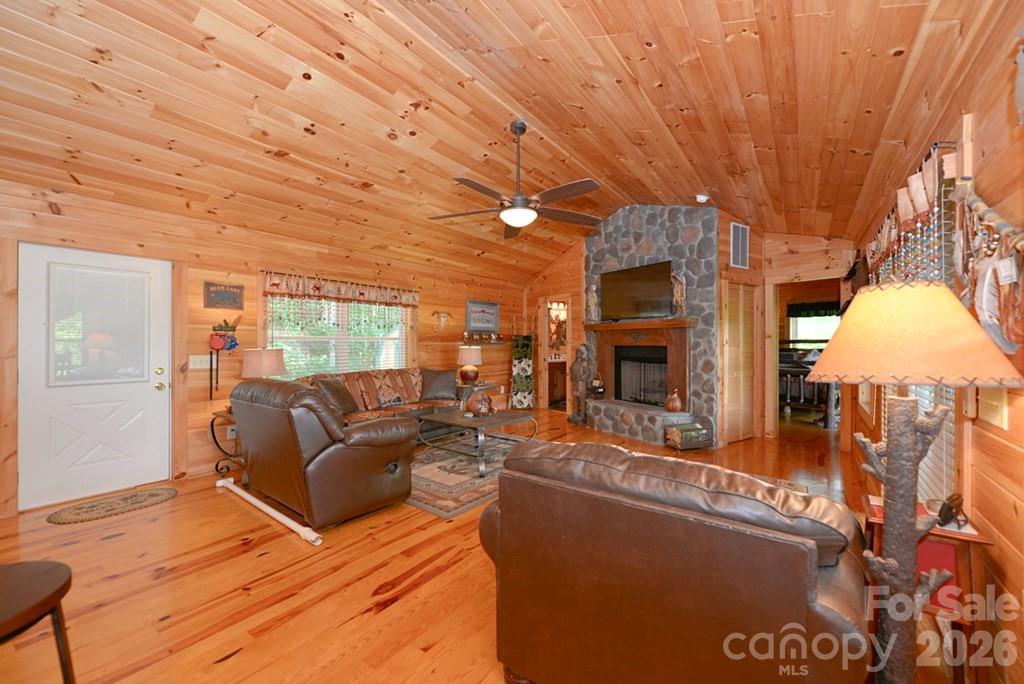 470 Bear Ridge Road Tuckasegee, NC 28783 - Photo 11 of 28 a living room with furniture and a fireplace