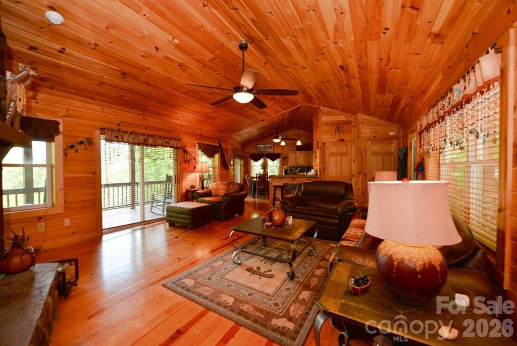 470 Bear Ridge Road Tuckasegee, NC 28783 - Photo 12 of 28 a living room with furniture a couch and wooden floor
