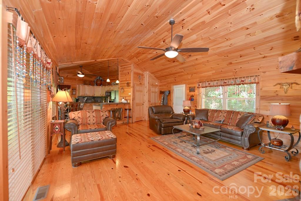 470 Bear Ridge Road Tuckasegee, NC 28783 - Photo 14 of 28 a living room with furniture and a large window