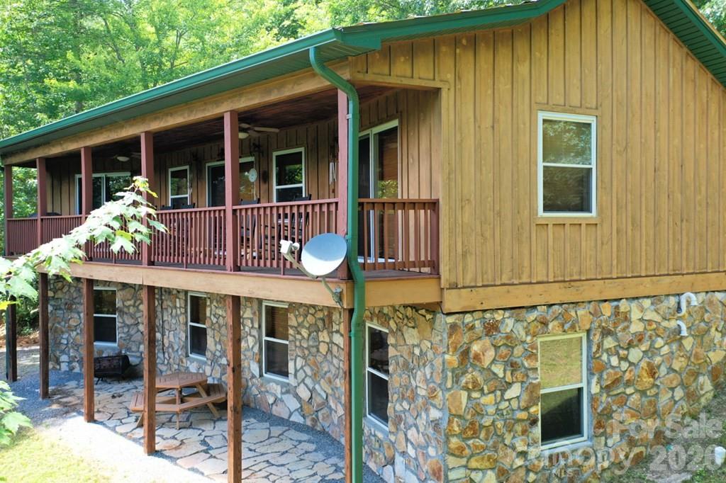 470 Bear Ridge Road Tuckasegee, NC 28783 - Photo 3 of 28 a front view of a house having patio