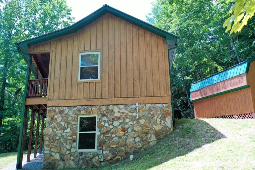 470 Bear Ridge Road Tuckasegee, NC 28783 - Photo 4 of 28 a front view of a house with garden