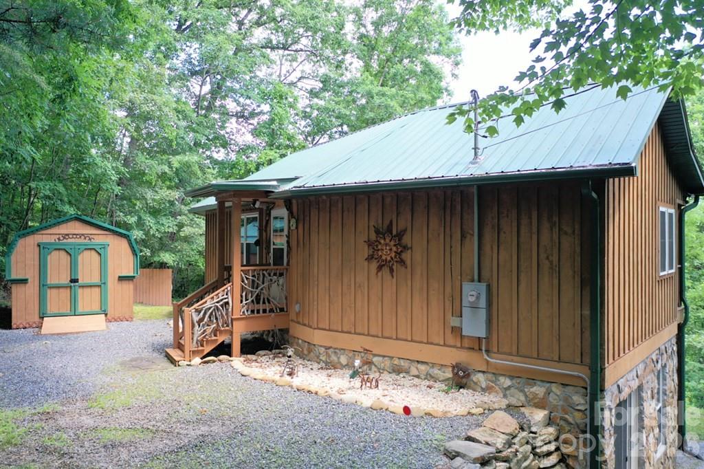 470 Bear Ridge Road Tuckasegee, NC 28783 - Photo 7 of 28 a house with trees in the background