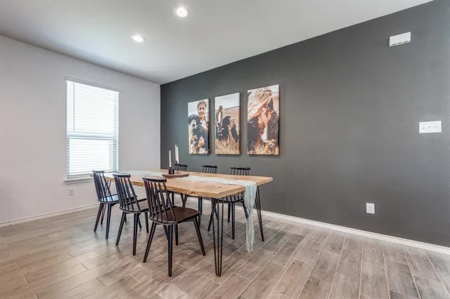 a view of a dining room with furniture window and outside view