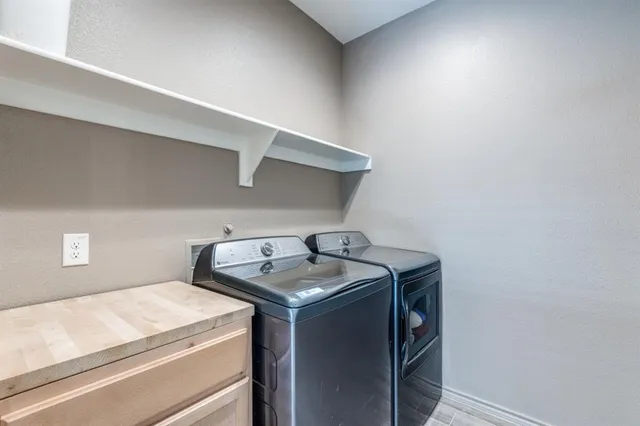 a utility room with washer and dryer