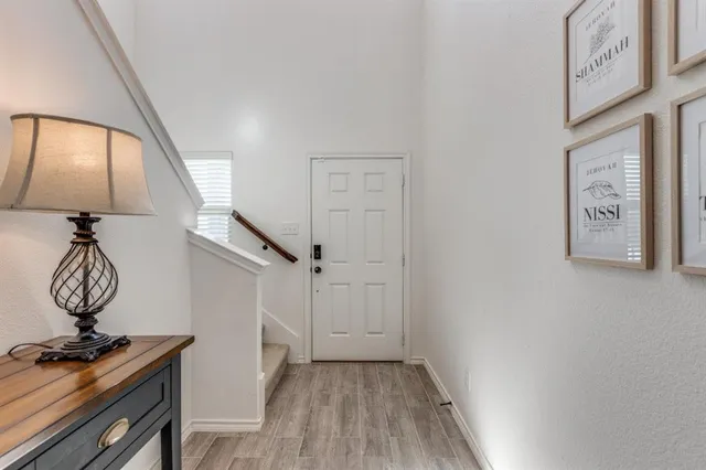 a view of entryway with wooden floor