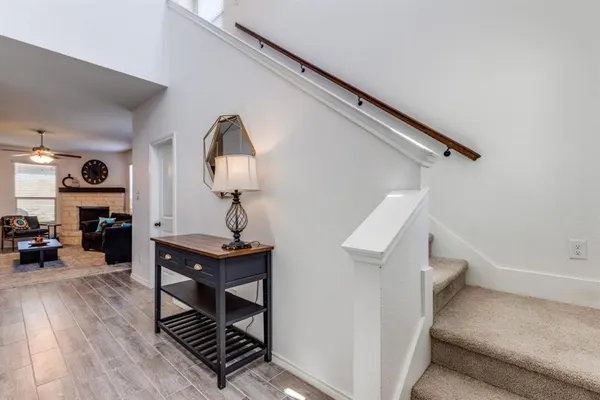 a view of a livingroom with furniture and wooden floor