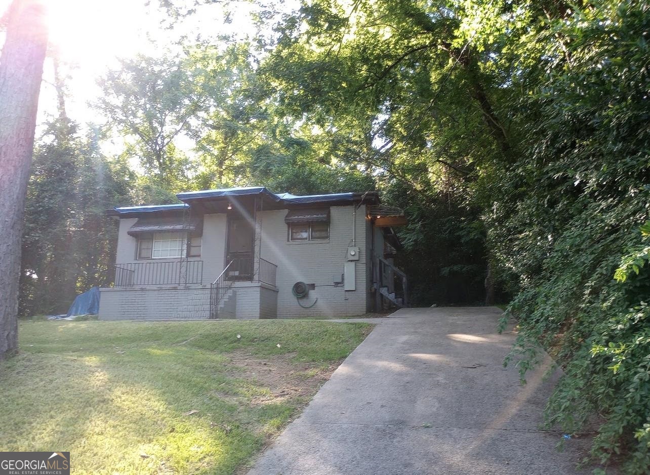 a view of a house with a back yard