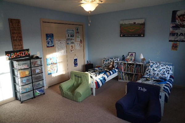175 Old Fall River Road Swansea, MA 02777 - Photo 12 of 21 a bedroom with furniture and a book shelf