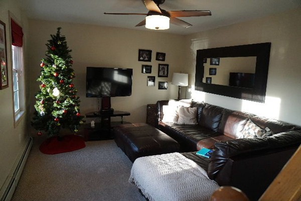 175 Old Fall River Road Swansea, MA 02777 - Photo 3 of 21 a living room with furniture and a flat screen tv
