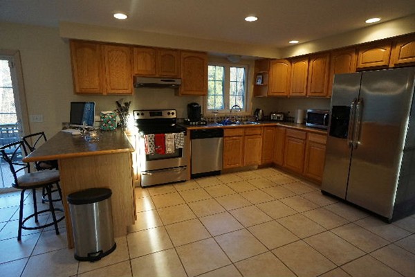 175 Old Fall River Road Swansea, MA 02777 - Photo 4 of 21 a kitchen with granite countertop a sink a counter top space appliances and cabinets