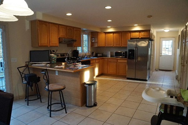 175 Old Fall River Road Swansea, MA 02777 - Photo 6 of 21 a kitchen with stainless steel appliances granite countertop a sink refrigerator and cabinets