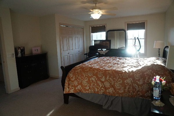 175 Old Fall River Road Swansea, MA 02777 - Photo 10 of 21 a bed sitting in a bedroom and chandelier