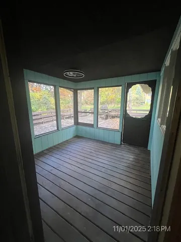 a bathroom with a glass shower door