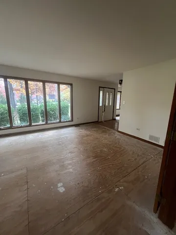 a view of kitchen and a refrigerator