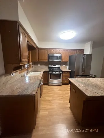 a view of a livingroom with an empty space and a fireplace