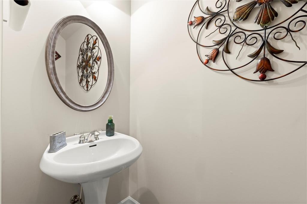 1207 Mistyhaynes Way Grayson, GA 30017 - Photo 13 of 37 a bathroom with a sink and a mirror