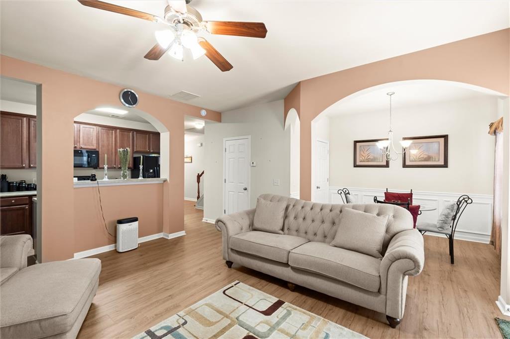 1207 Mistyhaynes Way Grayson, GA 30017 - Photo 18 of 37 a living room with furniture and a flat screen tv