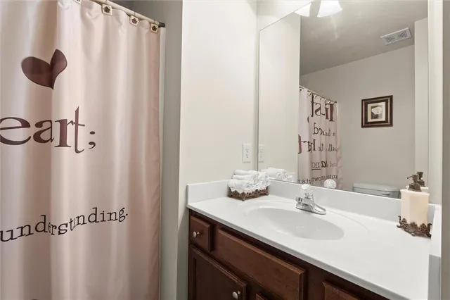 a bathroom with a sink and mirror