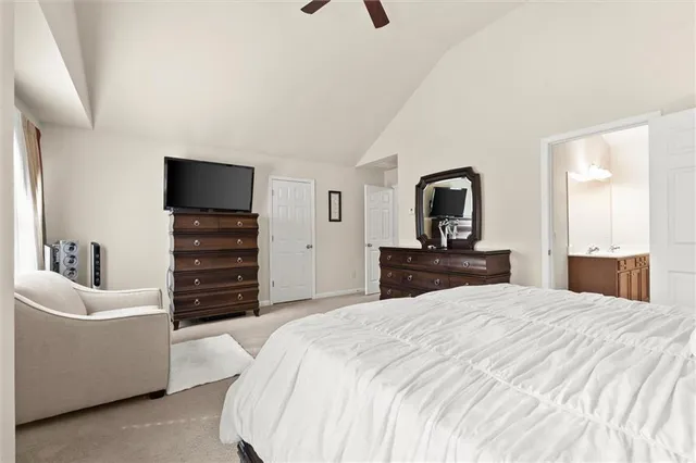 a bedroom with a bed and a television