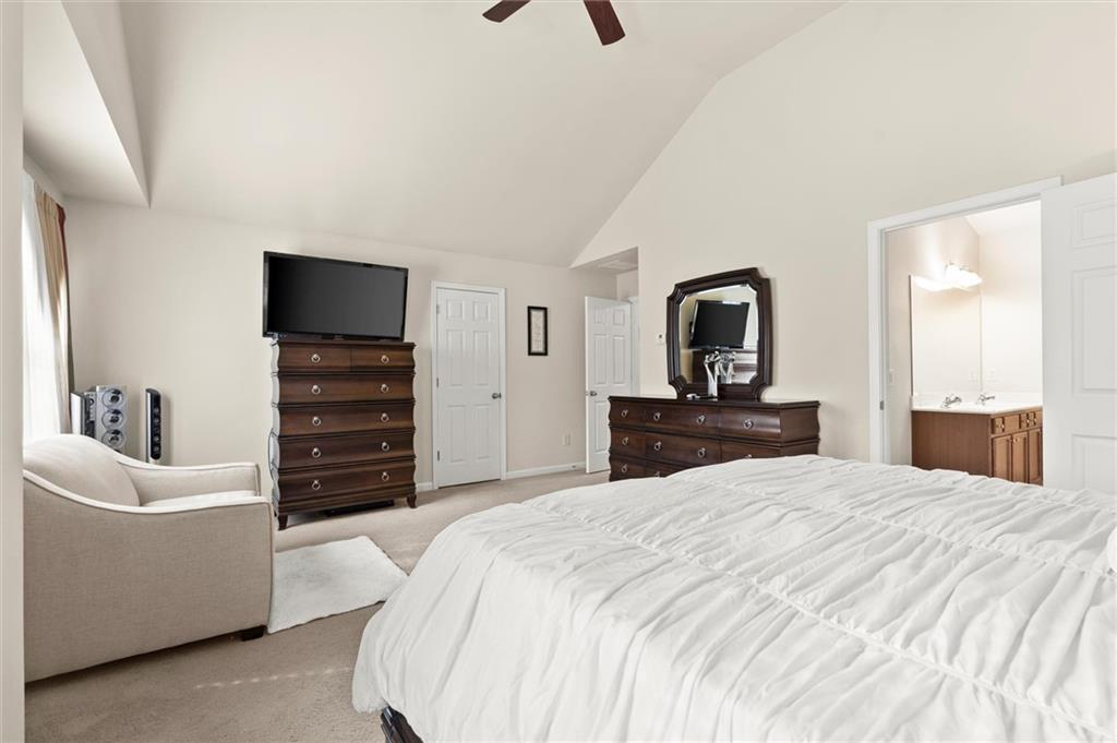 1207 Mistyhaynes Way Grayson, GA 30017 - Photo 26 of 37 a bedroom with a bed and a television