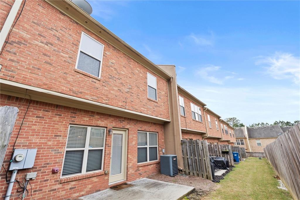 1207 Mistyhaynes Way Grayson, GA 30017 - Photo 36 of 37 a front view of a house with a yard