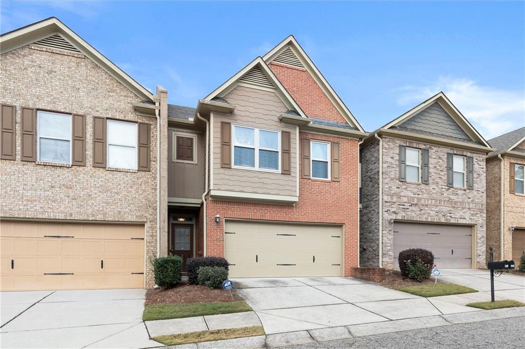 1207 Mistyhaynes Way Grayson, GA 30017 - Photo 6 of 37 a front view of a house with a yard and garage