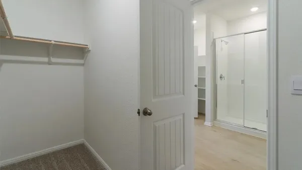 a view of a hallway with closet area