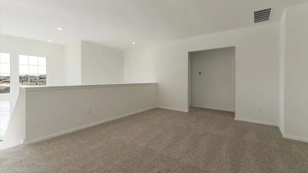 a white toilet sitting next to a shower