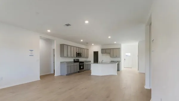 a view of kitchen and refrigerator in a kitchen