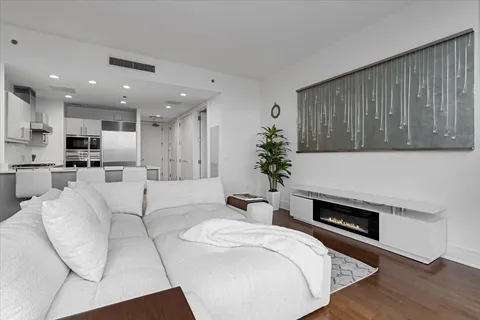 a large bedroom with a large bed and a large window