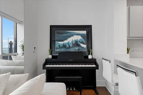 a view of a living room hardwood floor and staircase