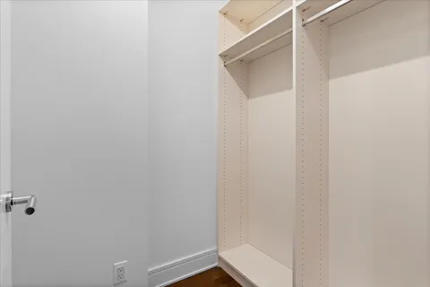 a bathroom with a bathtub shower sink double and mirror